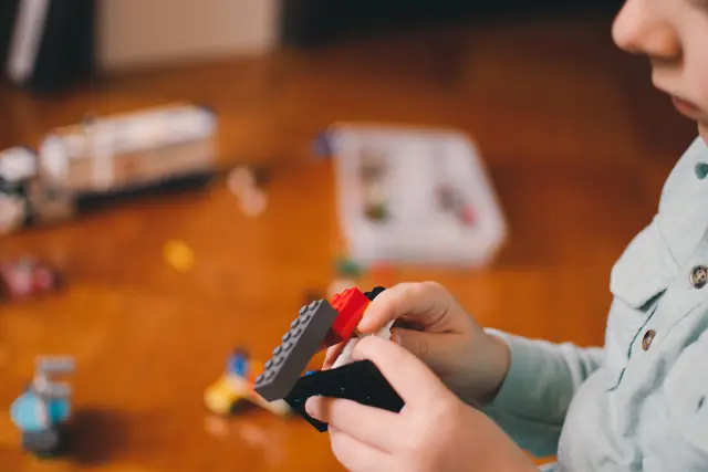 A child building with construction bricks